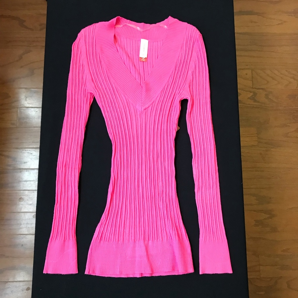 Pink V neck sweater.